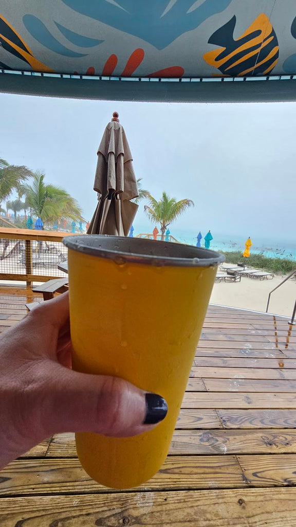 beverage with the beach and storm in the background at Disney Lookout Cay at Lighthouse Point