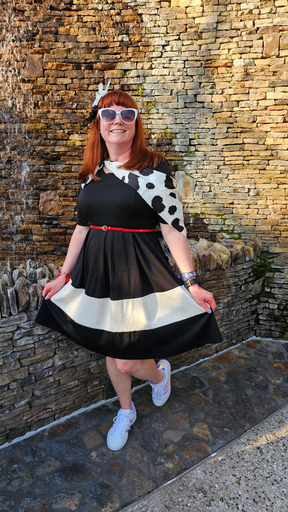 Kelly bounding as Dapper Cruella at Disney Springs