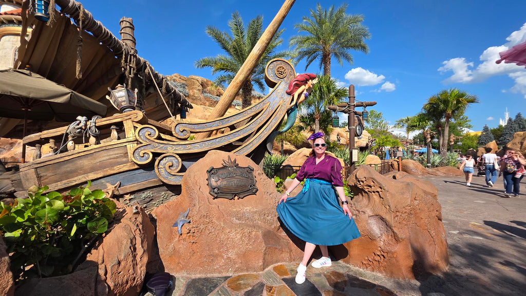 Kelly in her Dapper Ariel bound at Magic Kingdom in front of Under the Sea - Journey of The Little Mermaid