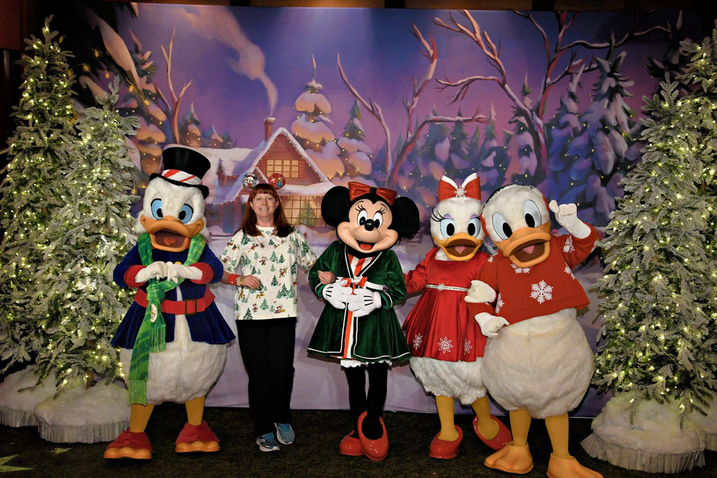 Kelly with Minnie, Daisy, Donald and Scrooge at Mickey’s Very Merry Christmas Party